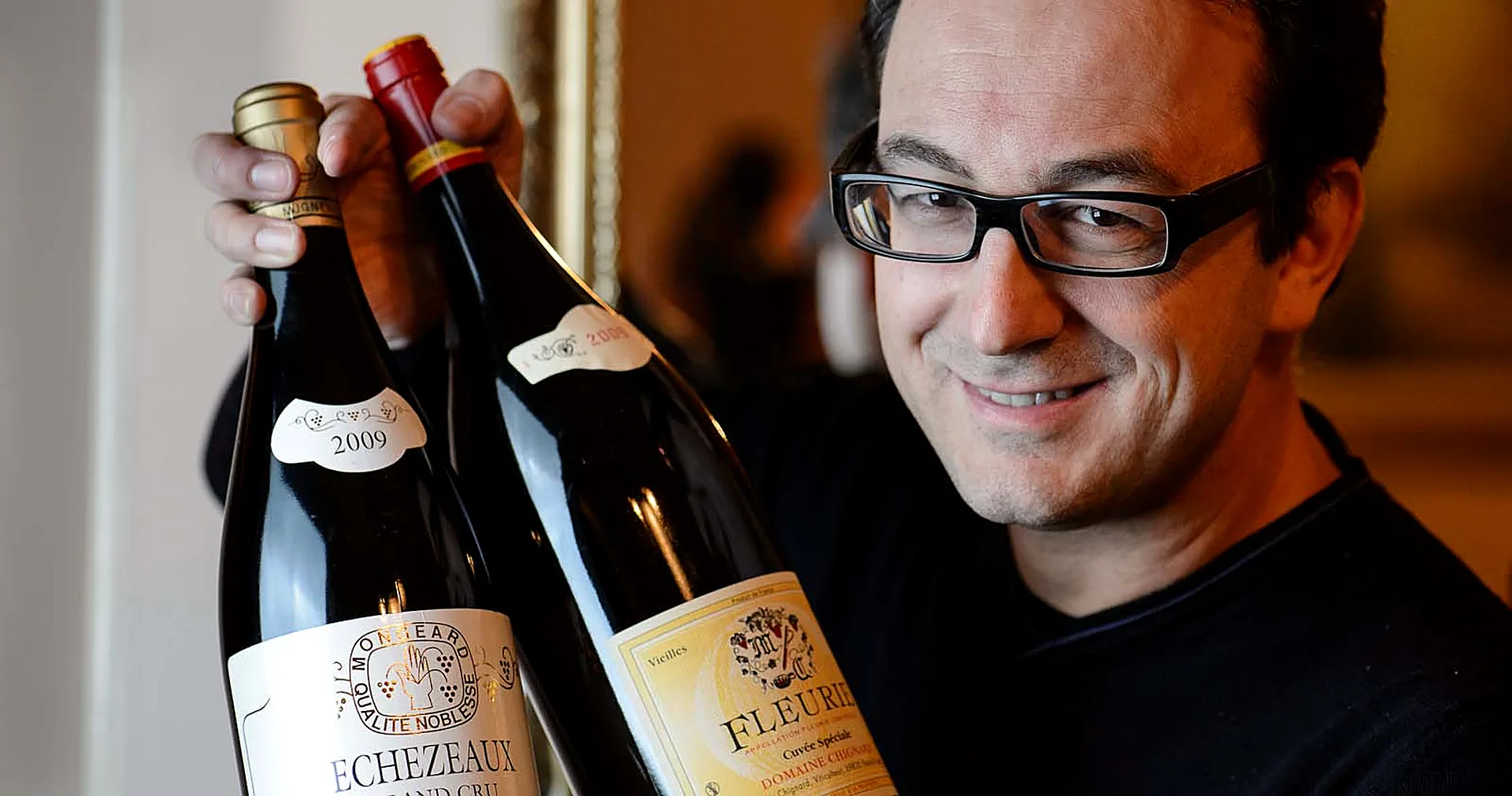 Sommelier presenting a bottle of Burgundy in the dining room